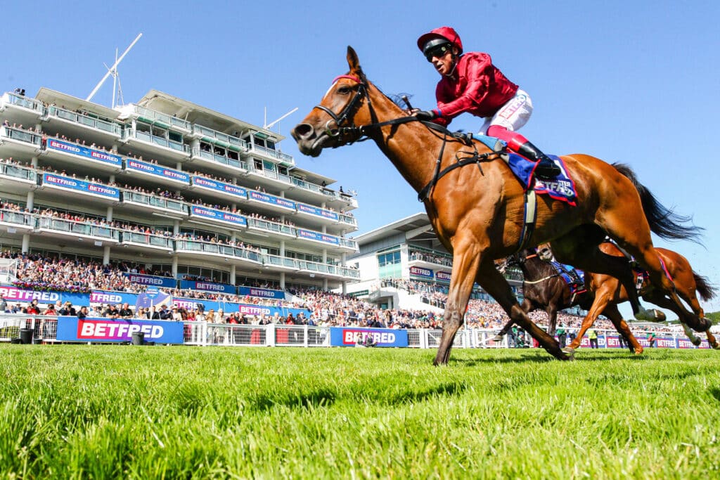 Epsom Ladies Day Soul Sister ridden by Frankie Dettori (Maroon) wins the Betfred Oaks on Ladies Day during the 2023 Derb